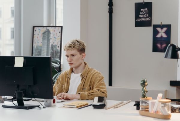 React JS Front End Engineer coding on his workstation