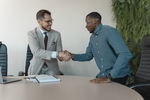 A recruiter shake hand with a new employee